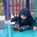 Pulling himself onto the slide